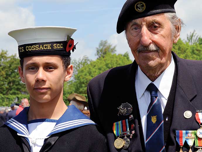 Remembrance Travel – Young sea cadet with older veteran
